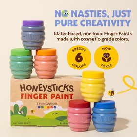 Honeysticks finger paint being wiped off from toddler hands for easy cleanup