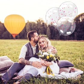 Honoson Bobo wedding and party backdrop with clear balloons.