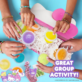 Horizon bow shaped glitter charms topping a slime creation for kawaii flair.