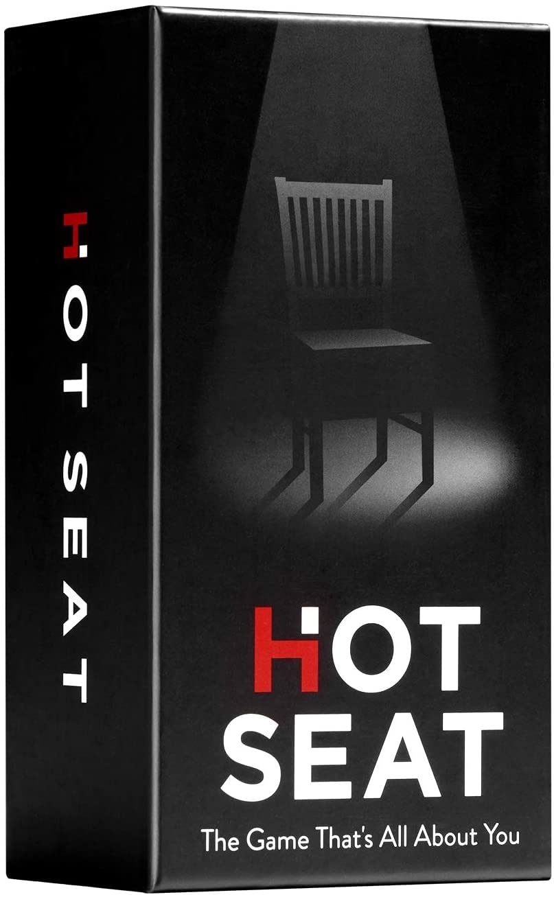 Hot Seat cover-table image with family game and cards for a cozy night