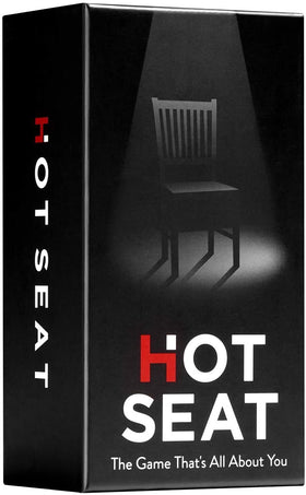 Hot Seat cover-table image with family game and cards for a cozy night