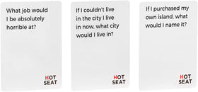 Hot Seat question card close-up with playful prompts for conversation