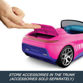 Hot Wheels Barbie RC Convertible remote control in hand for playtime.