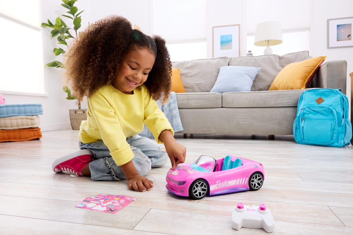 Hot Wheels Barbie RC Convertible interior showing two dolls on a pretend road trip.