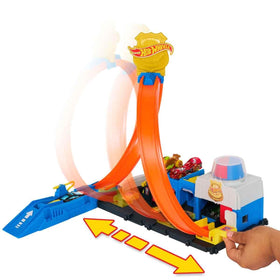 Hot Wheels four-lane racing paths on base for varied stunts.
