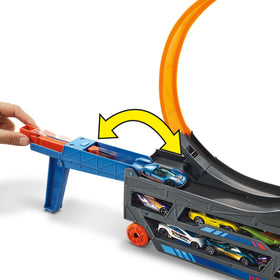 Hot Wheels loop action, car jumps through the big looping track.