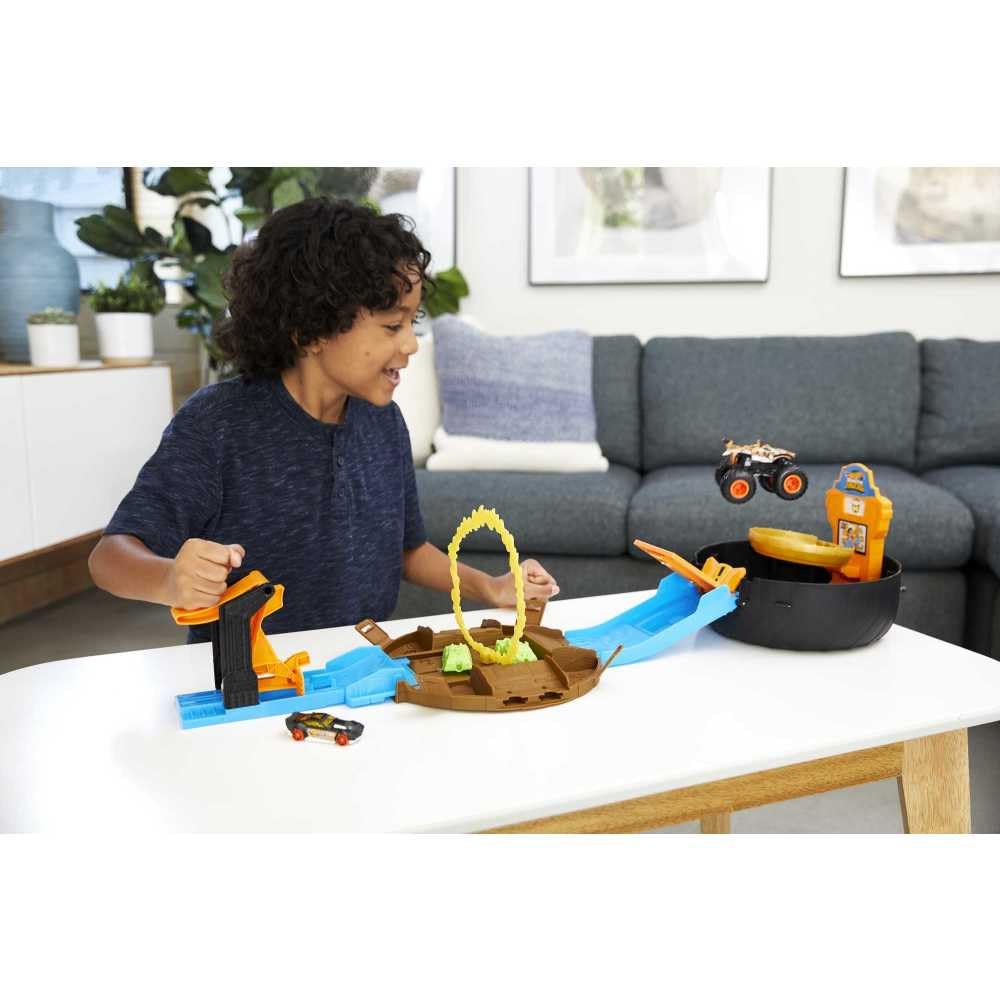 Hot Wheels Stunt Tire Playset closed with handle for easy portability.