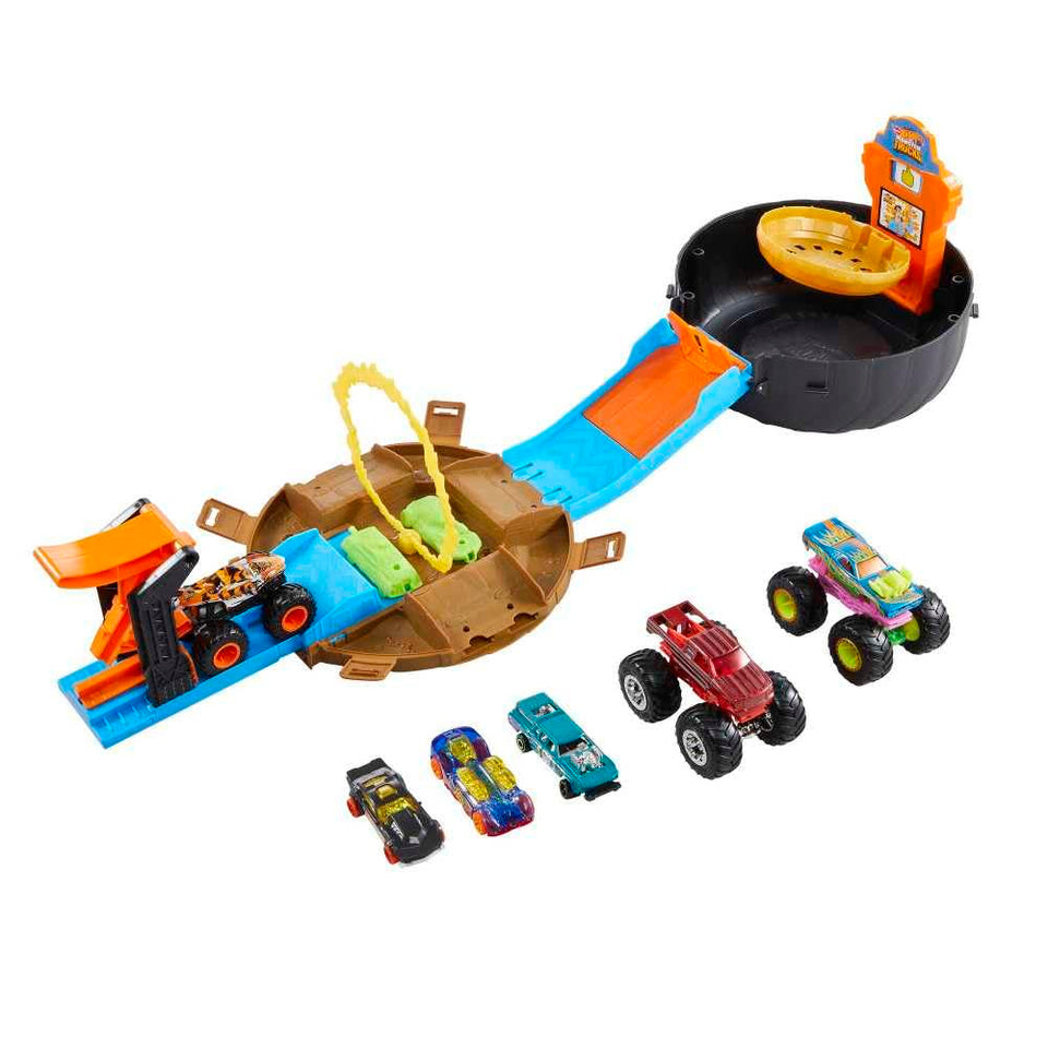 Hot Wheels Monster Trucks Stunt Tire Playset opened with action-ready trucks, ideal for on-the-go play.