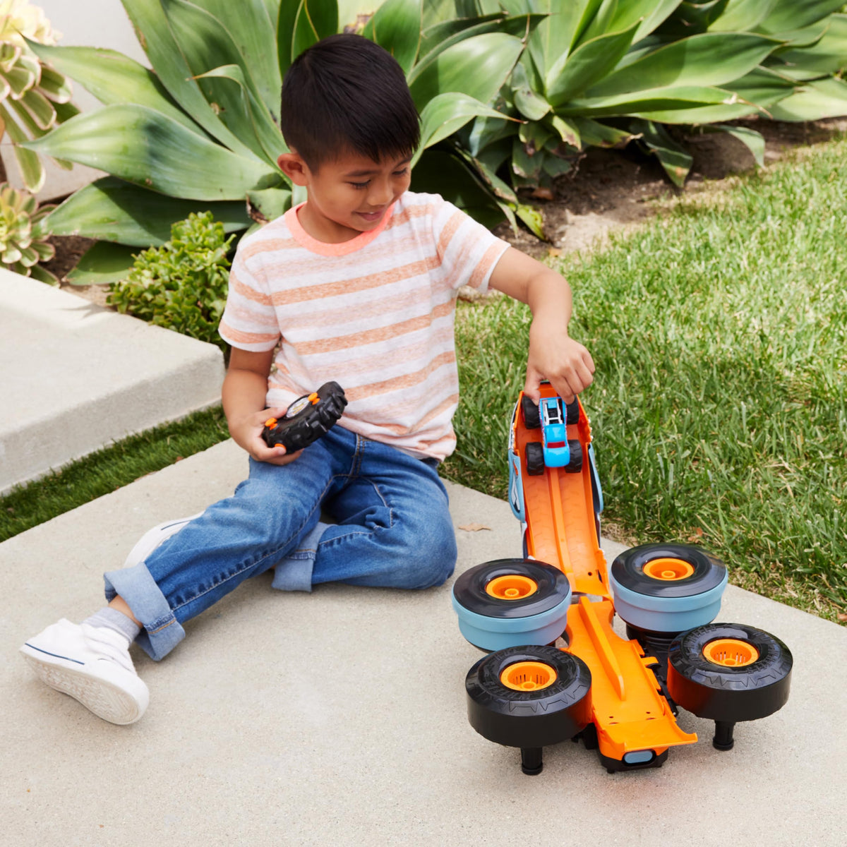 Hot Wheels Rhinomite 1:12 RC with oversized tires on indoor floors.