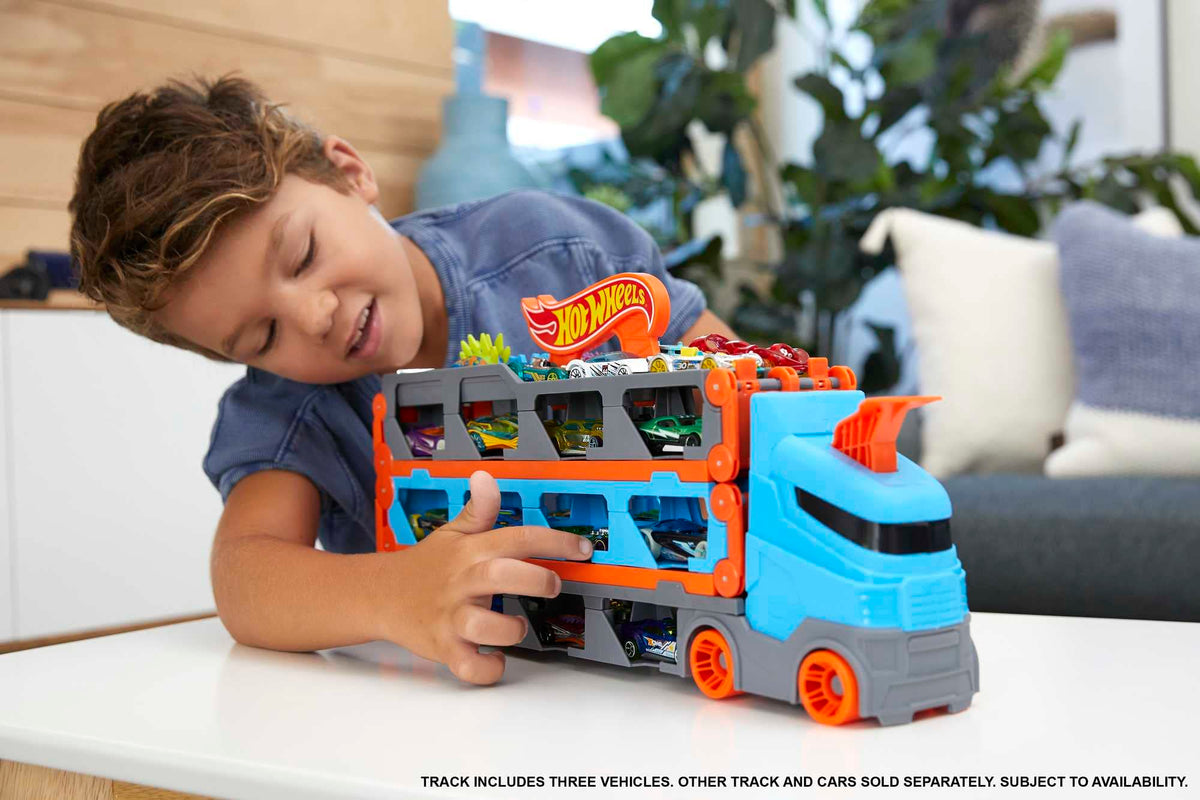 Hot Wheels Speedway Hauler unfolds into a 6-foot racetrack for epic play.