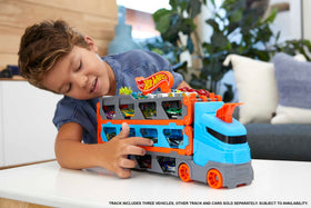 Hot Wheels Speedway Hauler unfolds into a 6-foot racetrack for epic play.