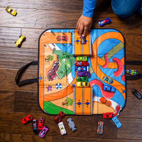 Hot Wheels Tara ZipBin Ramp It Up 21x21 playmat offers space for racing action.