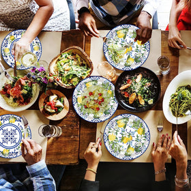 HSPAIDYP Capri Lemon party scene with blue and yellow plates on a sunny table.