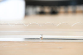 Protective plastic film shields racks during shipping and handling.