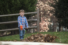 Husqvarna 125B toy leaf blower demonstrates airflow with visible streamers during play