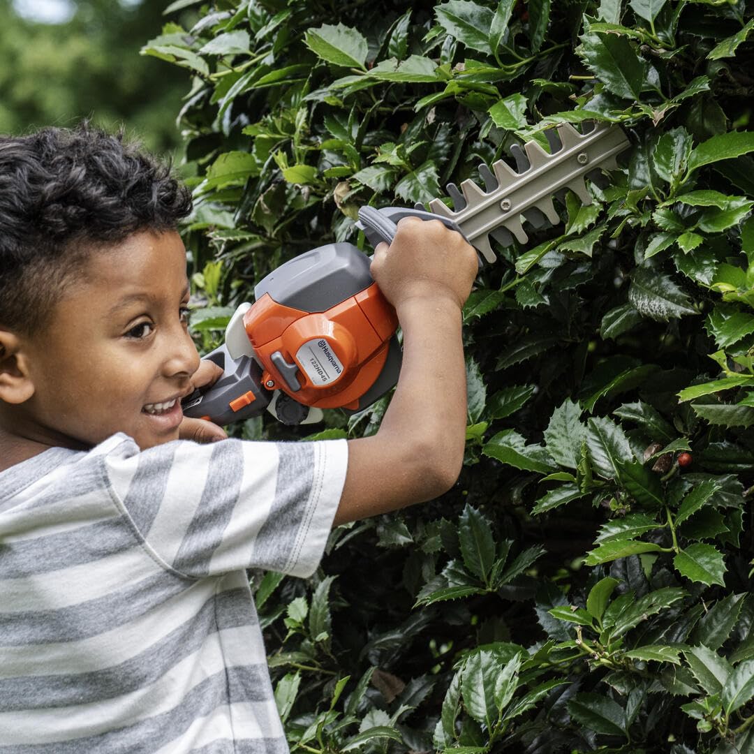 Husqvarna 122HD45 toy hedge trimmer imitation cutters in motion.