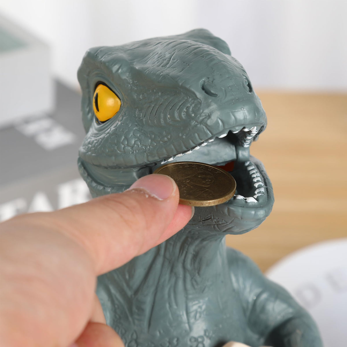 H&W Velociraptor cub piggy bank dimensions fit on shelves and desks.