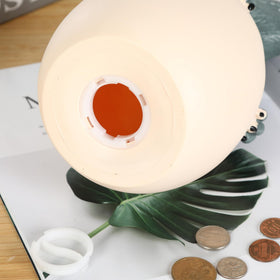 H&W Velociraptor cub piggy bank decorative room accent for kids' spaces.