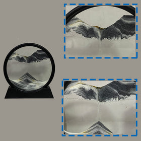 HYUGF Moving Sand Art Round Glass Frame displaying a vivid 3D sandscape on a desk.