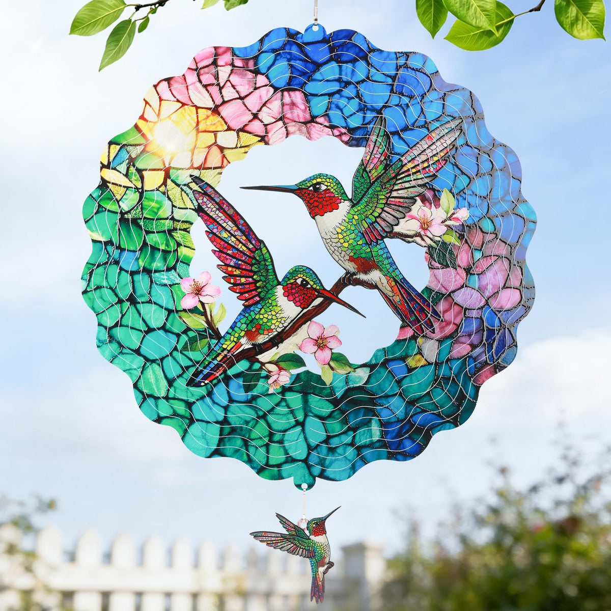 IDEA SHOW hummingbird wind spinner 12in spins gently in a garden for visual calm