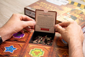 Identity Games puzzle pieces and decoder for step-by-step unlocking of rooms and story.