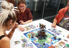 IELLO King of Monster Island boss battle scene showcases epic kaiju clashes and strategic choices.