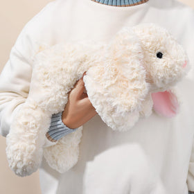 IFX24 adult-friendly rabbit plush resting on a couch for relaxation