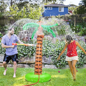 iGeeKid palm tree sprinkler top delivering refreshing backyard play in bright summer sun.