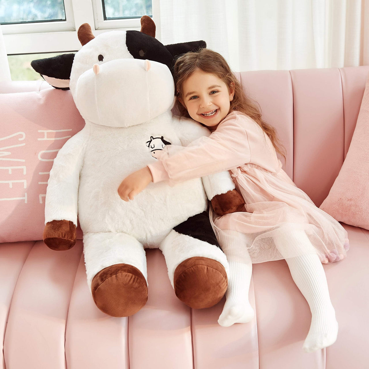 IKASA giant cow plush in a hug-size pose for cozy play.