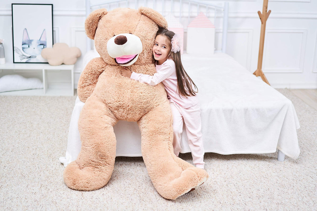 IKASA giant teddy bear warm brown fur invites comforting companionship in any room.