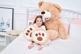 IKASA giant teddy bear child hug scene highlights safe, friendly companion for bedtime stories.