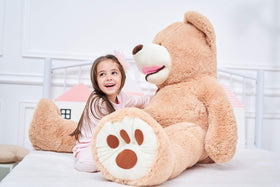 IKASA giant teddy bear in living room scene enhances cozy family space.