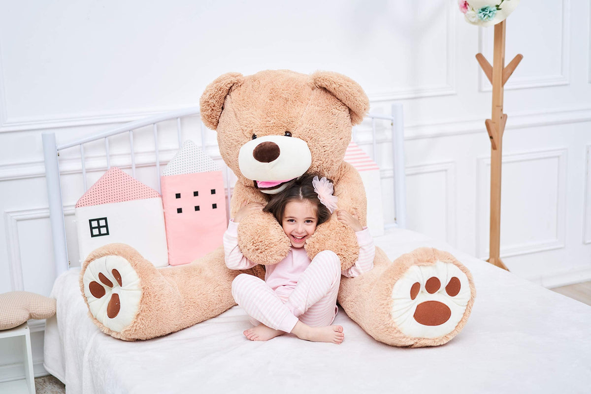 IKASA giant teddy bear soft hug pose emphasizes durable, plush construction for long-term cuddles.