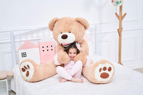 IKASA giant teddy bear soft hug pose emphasizes durable, plush construction for long-term cuddles.