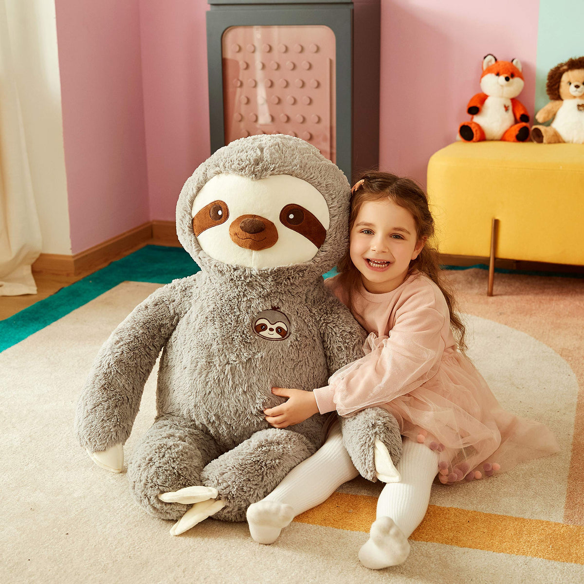 IKASA vacuum-pack sloth toy ships compact then expands to full size