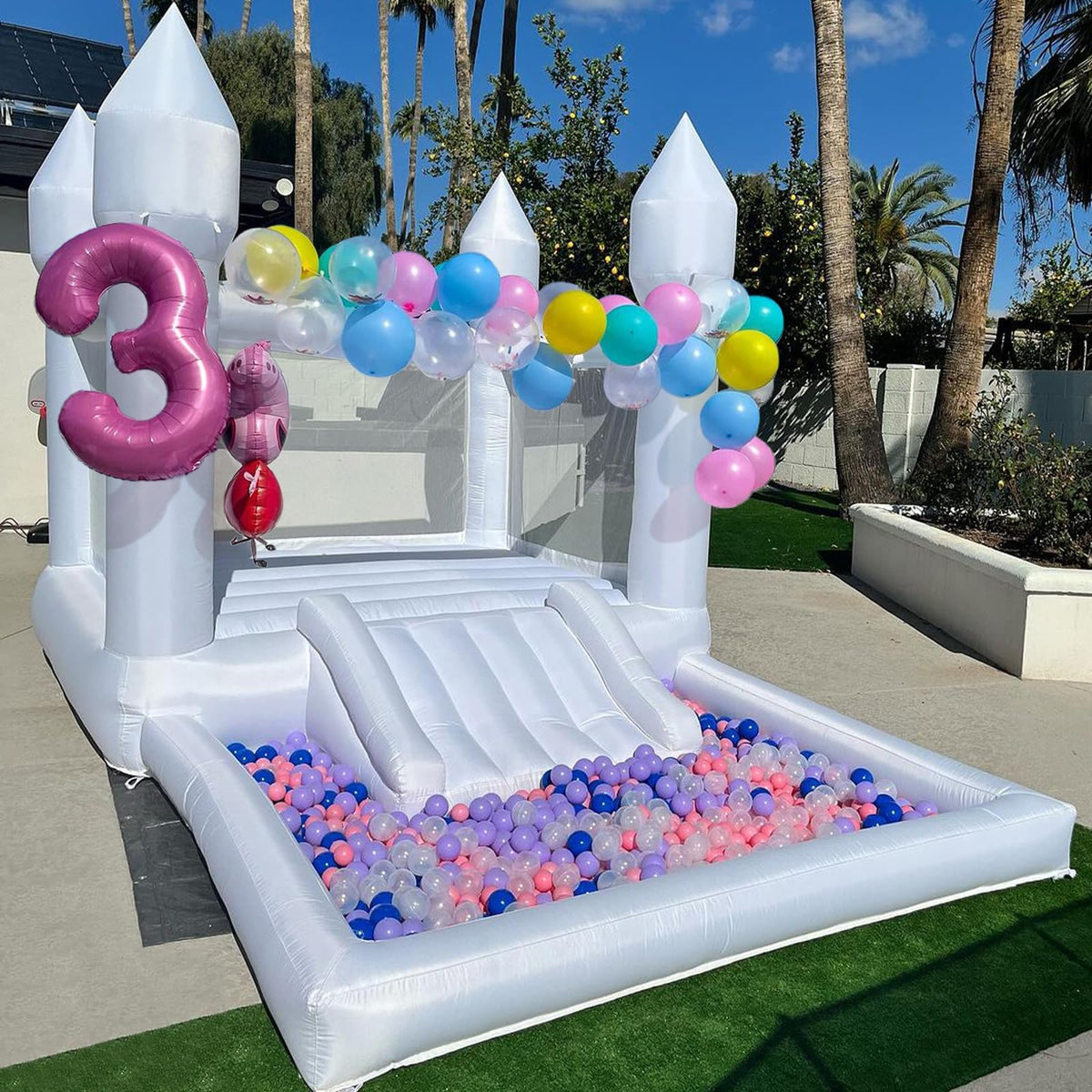 iLink-outer white bounce house setup in a backyard for easy celebrations