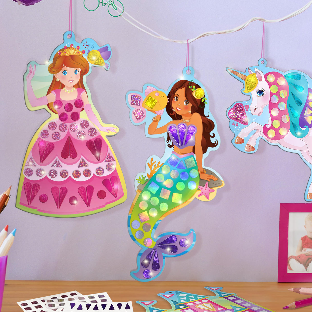 Imagimake Mirror Mosaic board and cord keep designs secure while kids craft on the go.