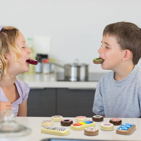 Kids engage with Imagination Generation wooden donuts for imaginative play