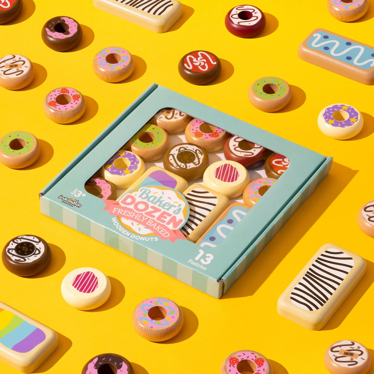 Three long john wooden donuts from Imagination Generation set for pretend kitchen