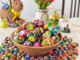 Six medium Pisanki eggs form a balanced mantel centerpiece.