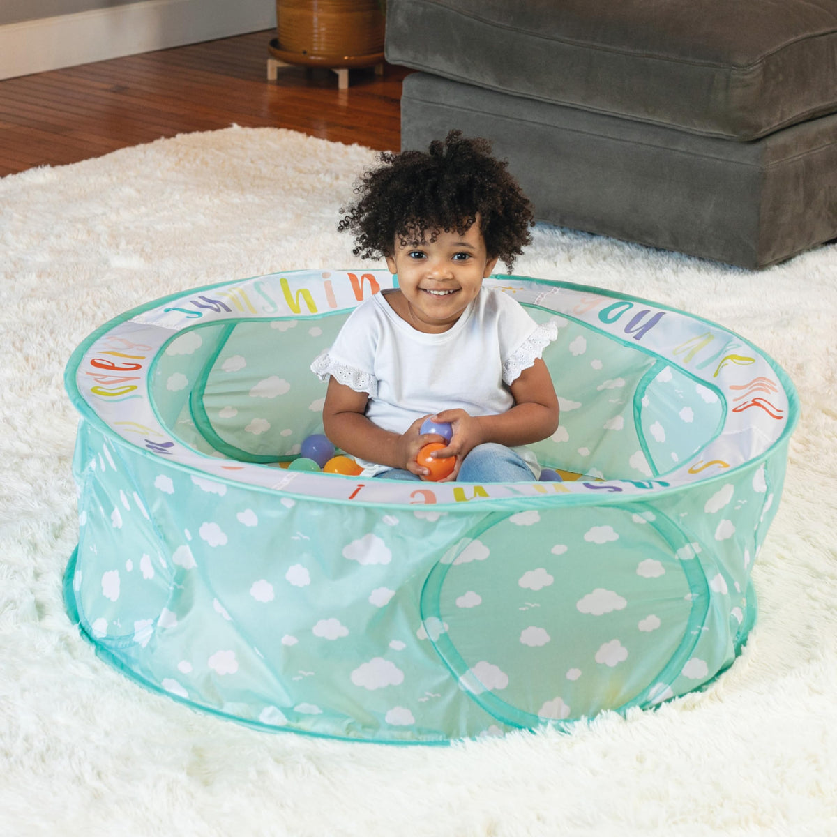 Infantino Pop-Up Ball Pit features a bright, colorful design for visual appeal during play.