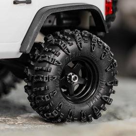 INJORA black 0.7" D18 wheels pair with rugged tires for realistic off-road sessions.
