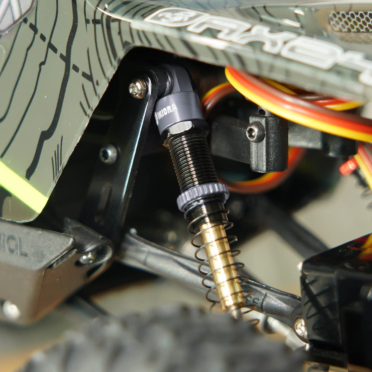 INJORA 27mm compressed length hole-to-hole allows precise tuning.