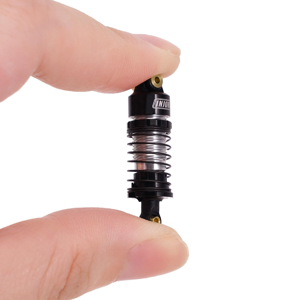 INJORA aluminum oil shocks threaded bodies enabling quick preload adjustments.