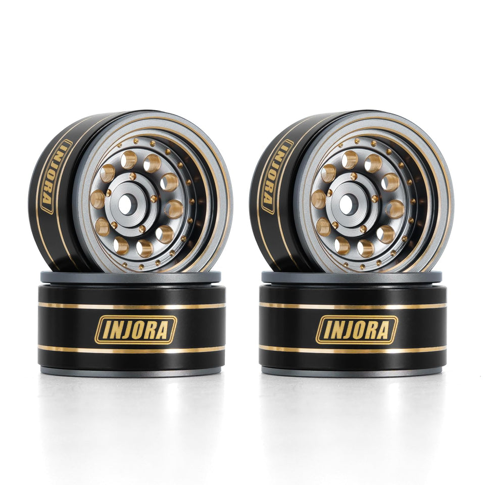 INJORA beadlock wheel rim with black coating and brass core for Axial SCX24 crawlers.