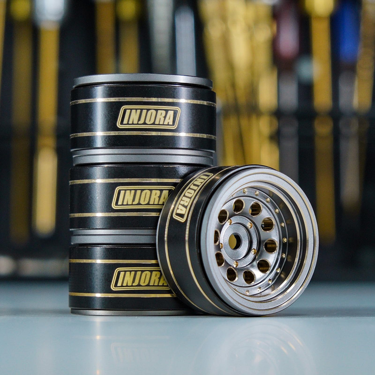 Durable brass finish on INJORA rim designed for rugged crawler use.