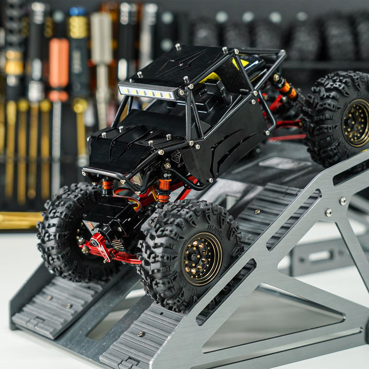 INJORA black body shell provides realistic scale appearance.