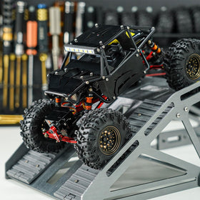 INJORA black body shell provides realistic scale appearance.