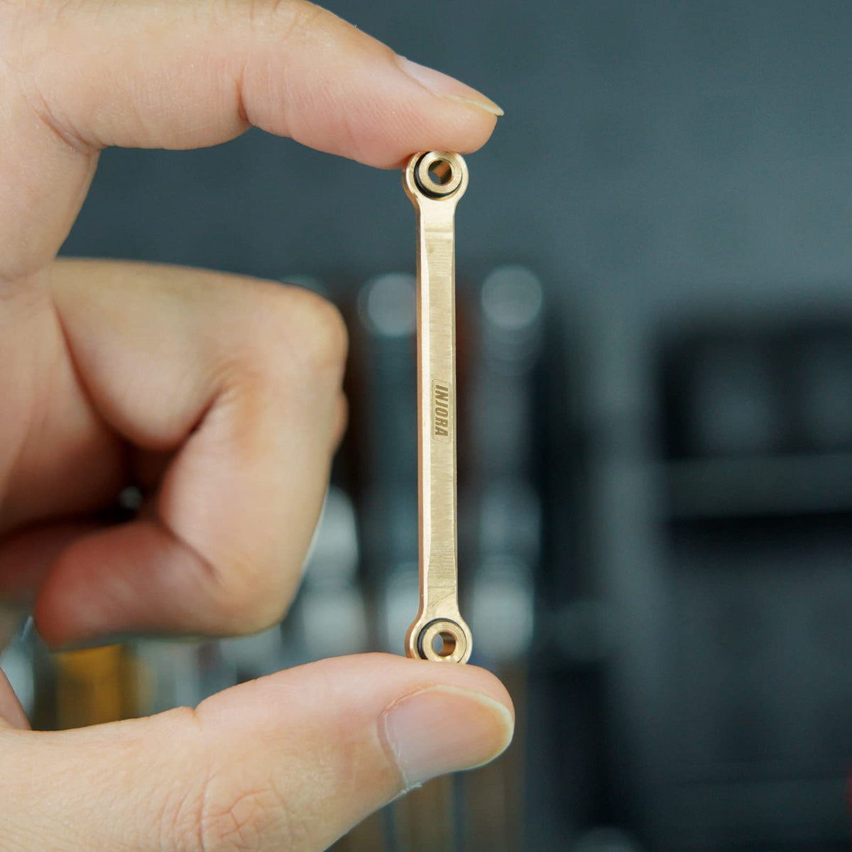 INJORA brass high clearance chassis links set climbing test demonstrates improved clearance on rugged trails