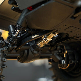INJORA brass high-clearance links packaging view reflects ready-to-install upgrade kit